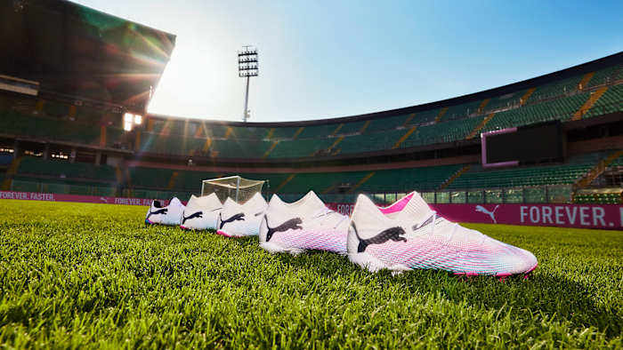 Side view of PUMA soccer cleats.